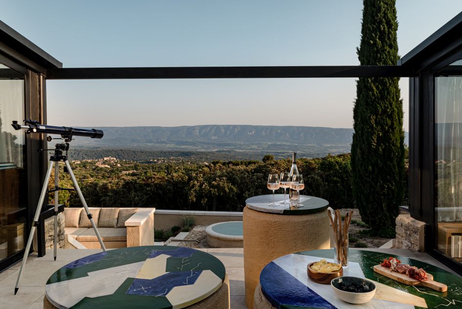 Stunning views towards the Luberon massif on the terrace at Les Hauts de Gordes, perfect for a luxury villa holiday in Provence.
