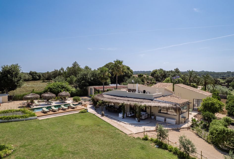Casa Verano, Mallorca View over the luxury private villa of Casa Verano in Mallorca, surrounded by a green countryside.
