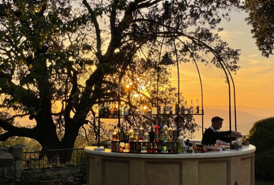 Sunset Cocktails at Borgo Pignano Estate Sunset behind the outdoor cocktail bar at Borgo Pignano, one of the many wining and dining establishments on site to enjoy on your luxury villa holidays in Tuscany.