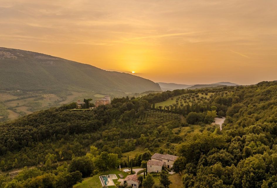 Villa Penna, The Murlo Estate, Umbria, Italy View over Villa Penna and the green rolling hills of The Murlo Estate, a luxury villa estate in Italy.