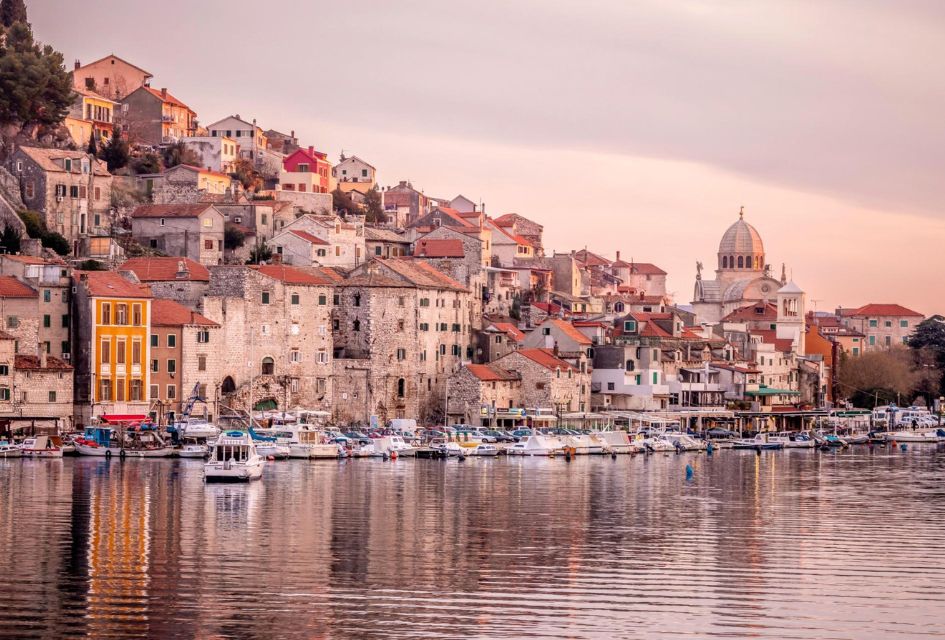 Šibenik, Croatia. Credit: CNTB - Julien Duval The historic city of Šibenik, Croatia, on the Dalmatian Coast, a set jetting destination that inspired many films, with boats on the sea, and buildings from the shore all the way up the hill, and a Cathedral in the distance.