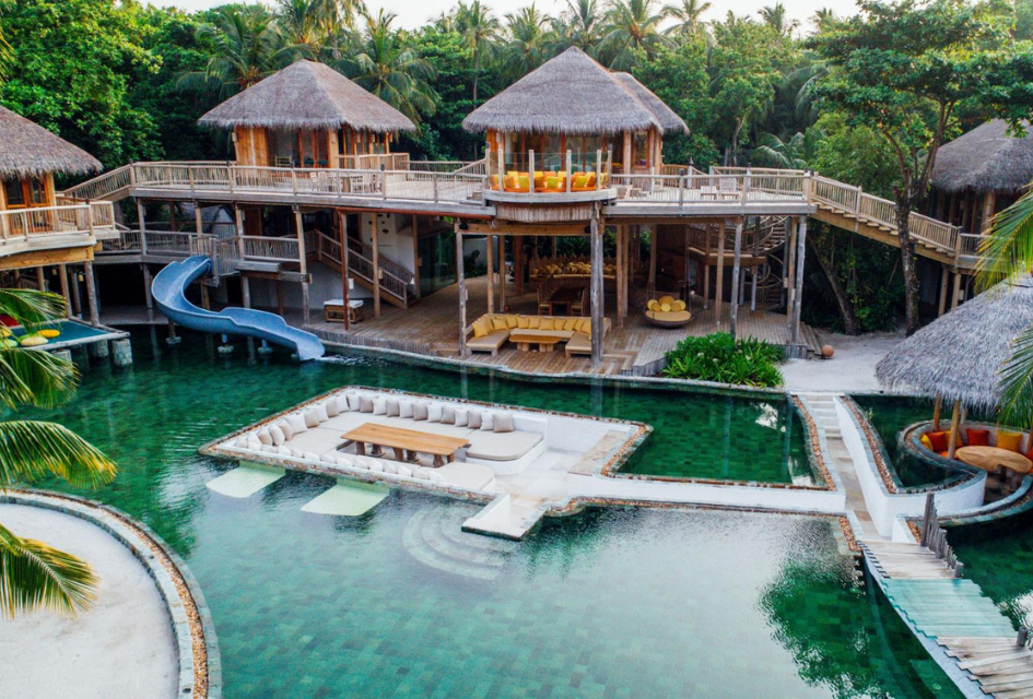 The Private Reserve, Soneva Fushi, Maldives The treehouse-style Private Reserve, a unique luxury villa with a waterslide entry into the saltwater pool, which also has a sunken dining table in the centre.