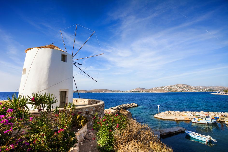 Parikia's famous windmill stands at the shores of the island's 'capital', often the first sight guests see on the arrival to their luxury holidays in Paros.