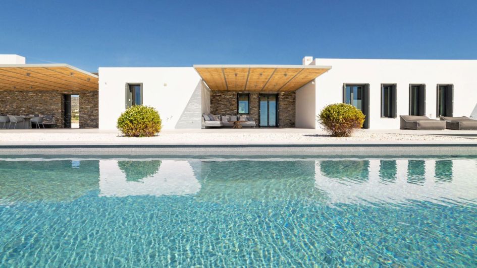 Villa Limpida hits the peak of luxury holidays in Paros. It's outdoor wellness pool and blue skies sandwich the inviting white and stone architecture of its exterior.