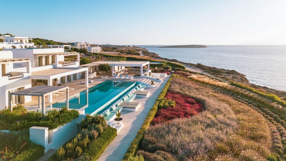 Villa Rising Sun is a luxury Paros villa residing on the northern region of the island, complete with an immense 30m infinity pool, classic white architecture and sea views, which can all be seen in this photo.