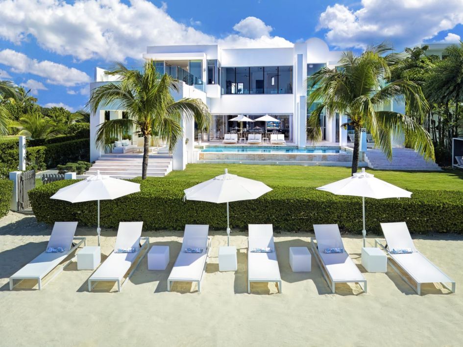 On the white sands of Meads Bay Beach, The Beach House in Anguilla typifies a Caribbean paradise. The luxury catered villa's striking white exteriors shine amongst blue skies, palm trees and white loungers which break up the golden sands, perfect for alfreco beach dining or Caribbean barbecues with the ones who matter most.