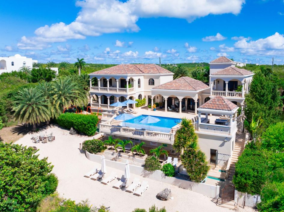 Sandcastle Villa, Anguilla Plenty of shaded areas offer a beautiful ocean view, a beautiful swimming pool with loungers leading down to the sand.