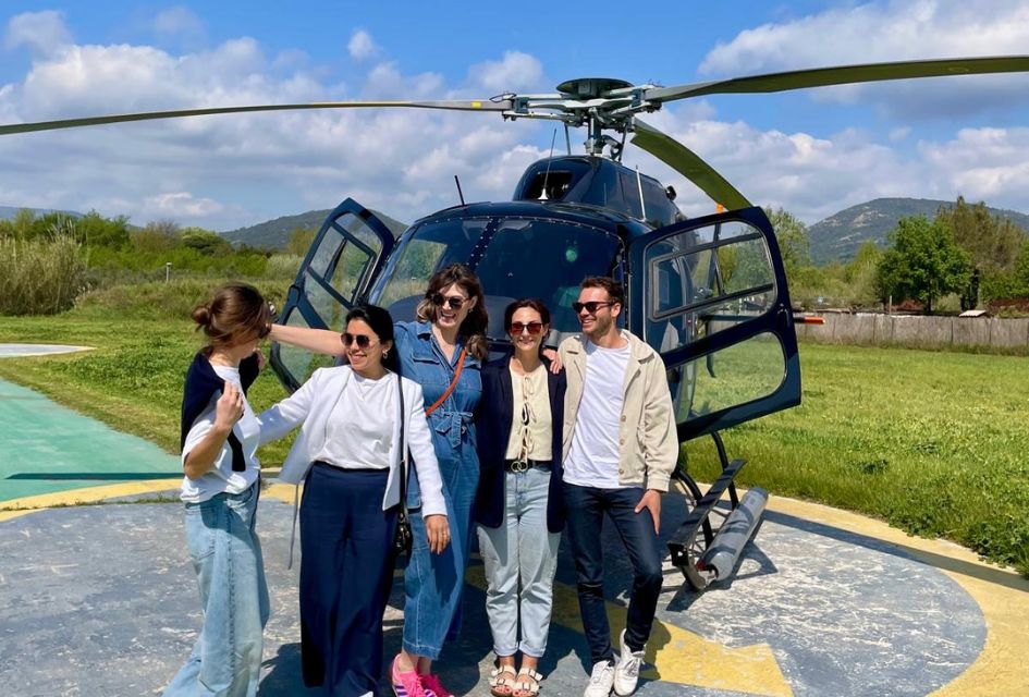 Heli-tour in St Tropez Group of people pictured in front of a helicopter before a heli-tour around ST Tropez.