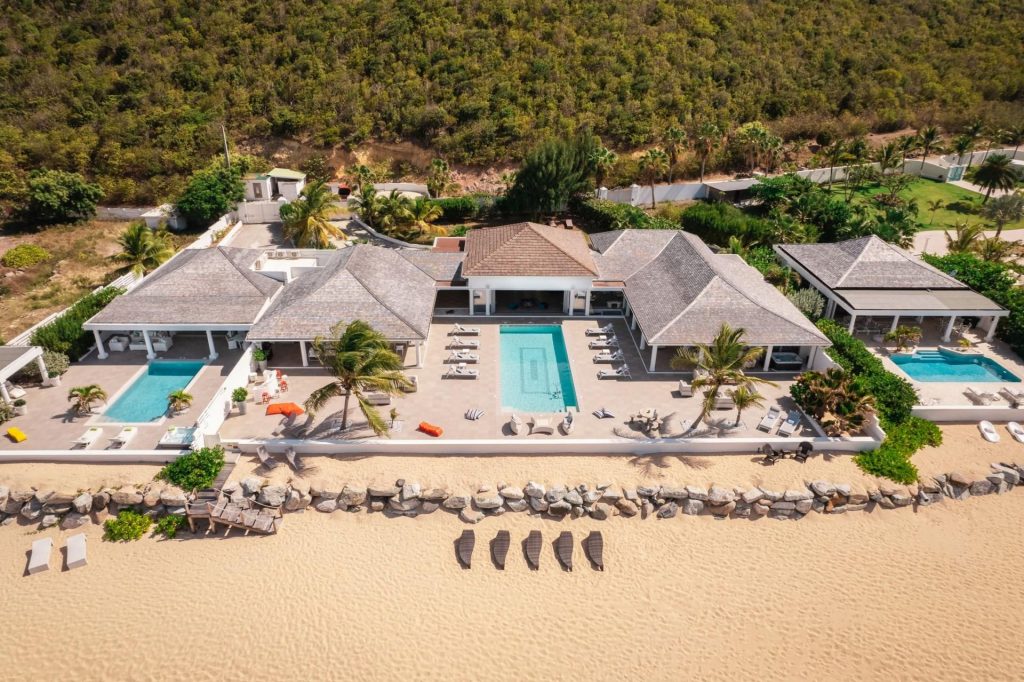 Villa La Perla Estate, Saint Martin Villa La Perla Estate is a picture of barefoot luxury in the Caribbean. Spread across three luxury beachfront villas, with direct access onto the sands of Baie Rouge beach, each one benefits from an outdoor pool and expansive terraces.