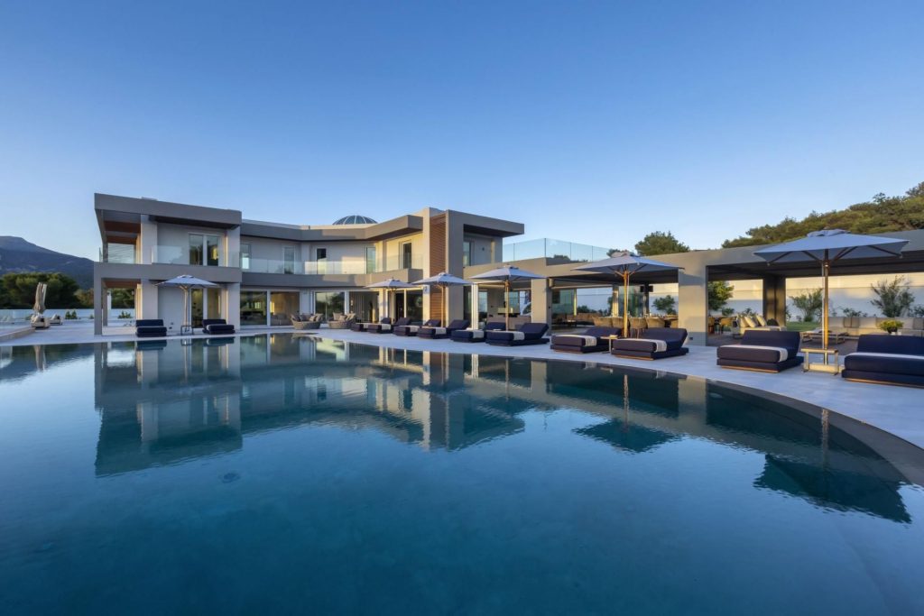 Villa Utopia, Peloponnese Villa Utopia's dramatic outdoor pool reflects the imposing structure of the architecture and clear blue skies above. However, the pool is just the start of the list making the property one of the best wellness villas around the world, featuring an outdoor hot tub, tennis court, fitness yoga room and more!