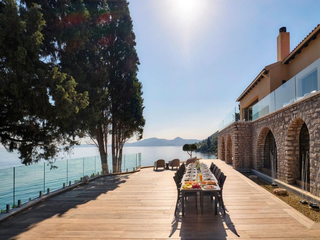 Villa Grace, Corfu The seafront terrace and alfresco dining area of Villa Grace - a luxurious villa retreat along Corfu's eastern coastline.